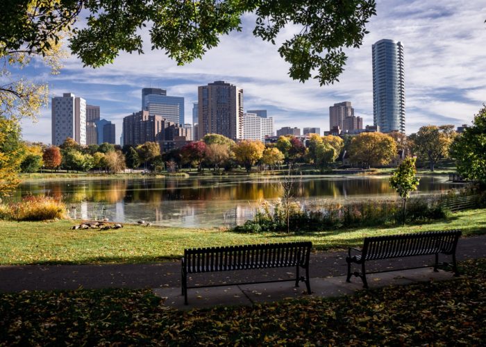 Minneapolis skyline overlooking a lake and park in Minnesota
